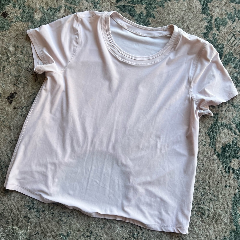 Lululemon size 6 dusty pink short sleeve running top with window back